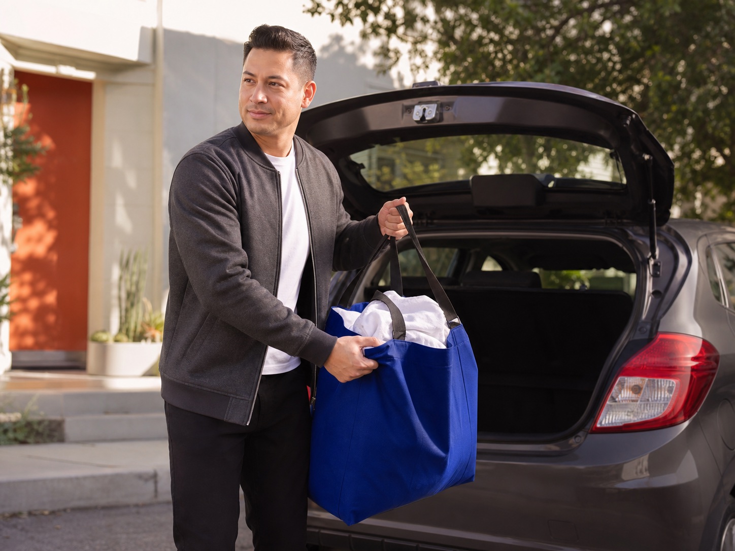 An independent laundry provider collecting an order from a vehicle